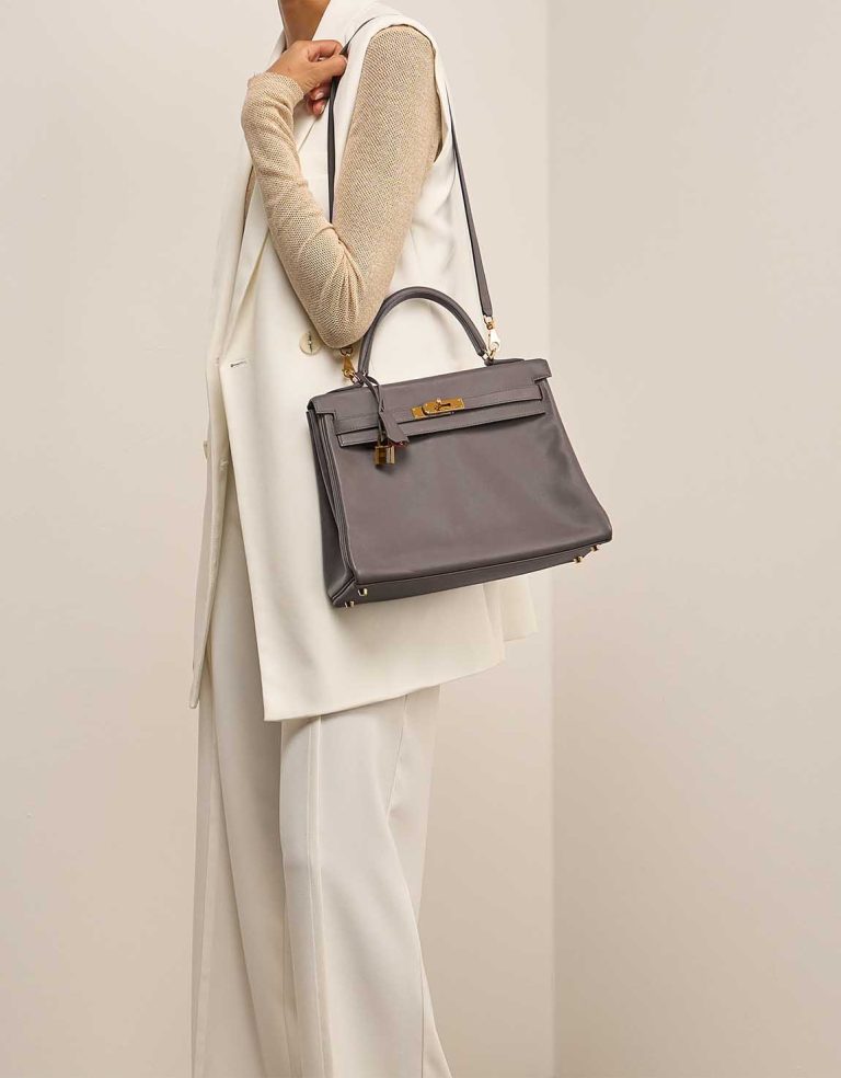Hermès Kelly HSS 32 Swift Gris Meyer / Rouge Grenat on Model | Sell your designer bag