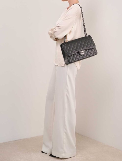 Chanel Timeless Jumbo Caviar Black on Model | Sell your designer bag