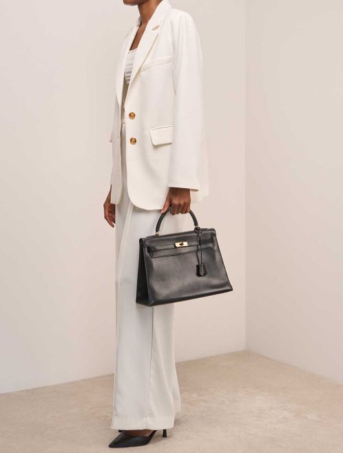 Hermès Kelly 32 Box Black on Model | Sell your designer bag