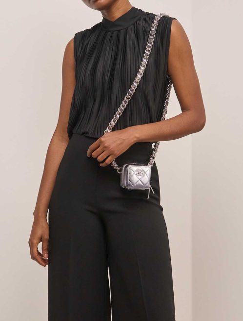 Chanel Timeless Micro Lamb Silver on Model | Sell your designer bag