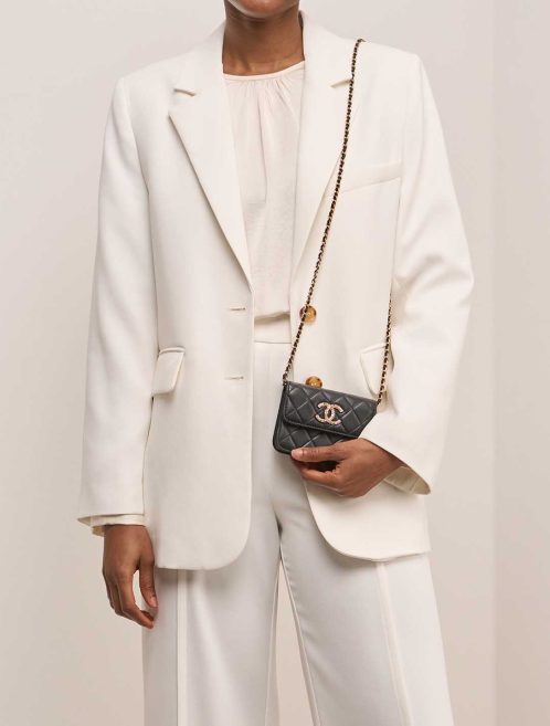 Chanel Timeless Micro Lamb Black on Model | Sell your designer bag