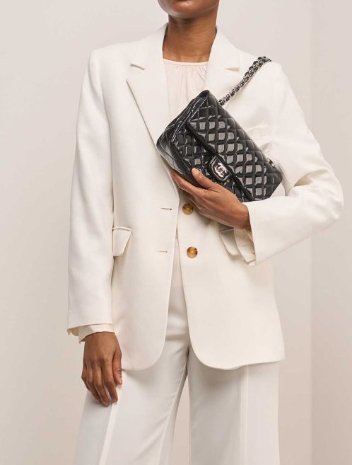 Chanel Timeless Medium Patent Black on Model | Sell your designer bag