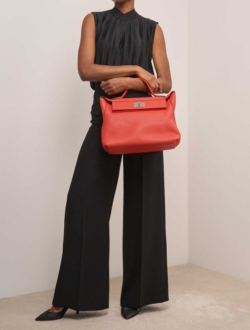Hermès 24/24 35 Swift / Taurillon Clémence Capucine on Model | Sell your designer bag