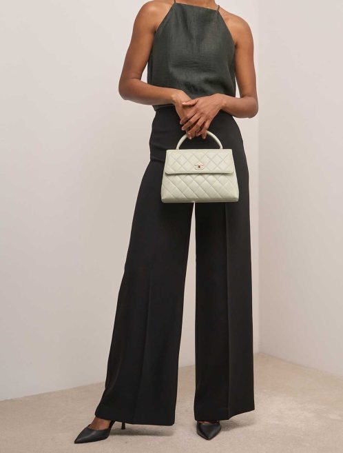 Chanel Timeless Handle Medium Lamb Mint on Model | Sell your designer bag