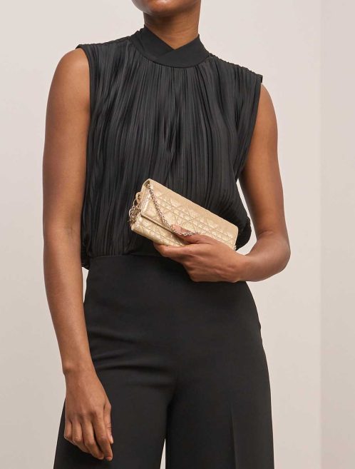 Dior Clutch with Chain Small Lamb Metallic Gold on Model | Sell your designer bag