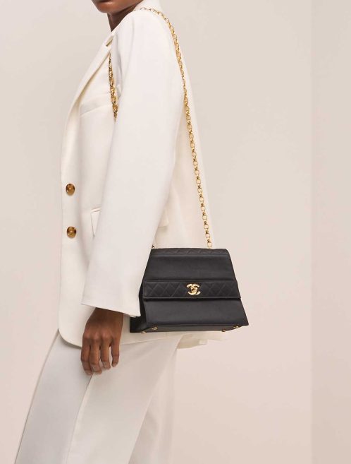 Chanel Timeless Clutch Small Satin Black on Model | Sell your designer bag
