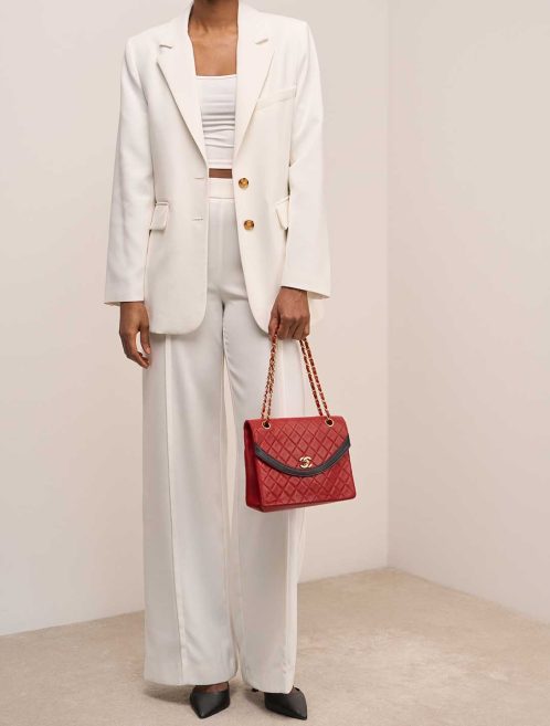 Chanel Coco Flap Medium Lamb Red / Black on Model | Sell your designer bag