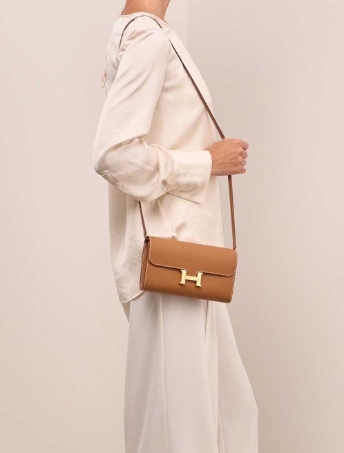 Hermès Constance To Go Epsom Gold on Model | Sell your designer bag