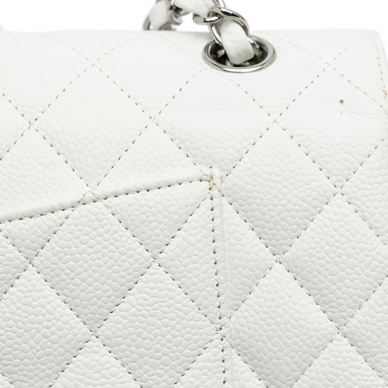 Chanel Timeless Medium Caviar White Signs of wear | Sell your designer bag