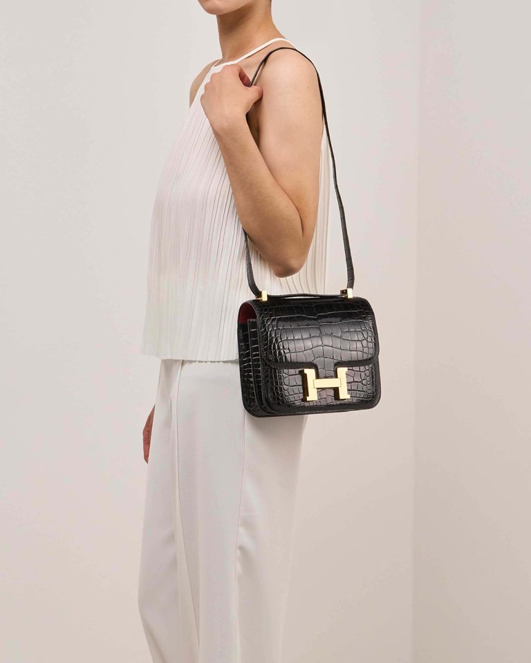 Hermès Constance 24 Alligator Mississippi Black / Rouge Grenat Front | Sell your designer bag