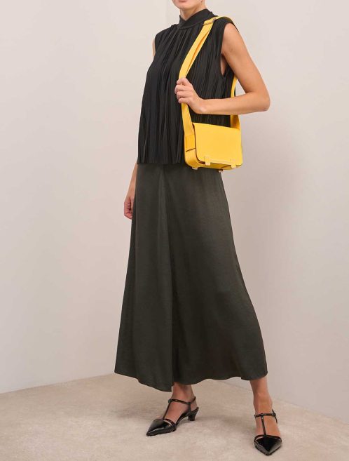 Hermès Geta Chèvre Mysore Jaune Citron / New Lime on Model | Sell your designer bag