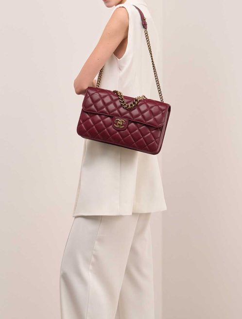 Chanel Timeless Jumbo Lamb Bordeaux on Model | Sell your designer bag