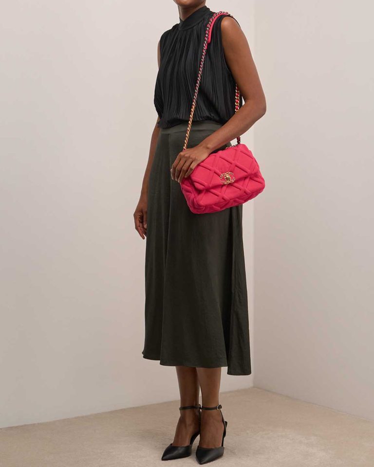 Chanel 19 Flap Bag Jersey / Lamb Pink on Model | Sell your designer bag