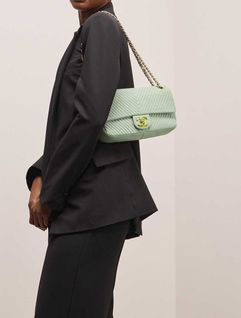 Chanel Flap Bag Chevron Medium Crinkled Calf Green on Model | Sell your designer bag