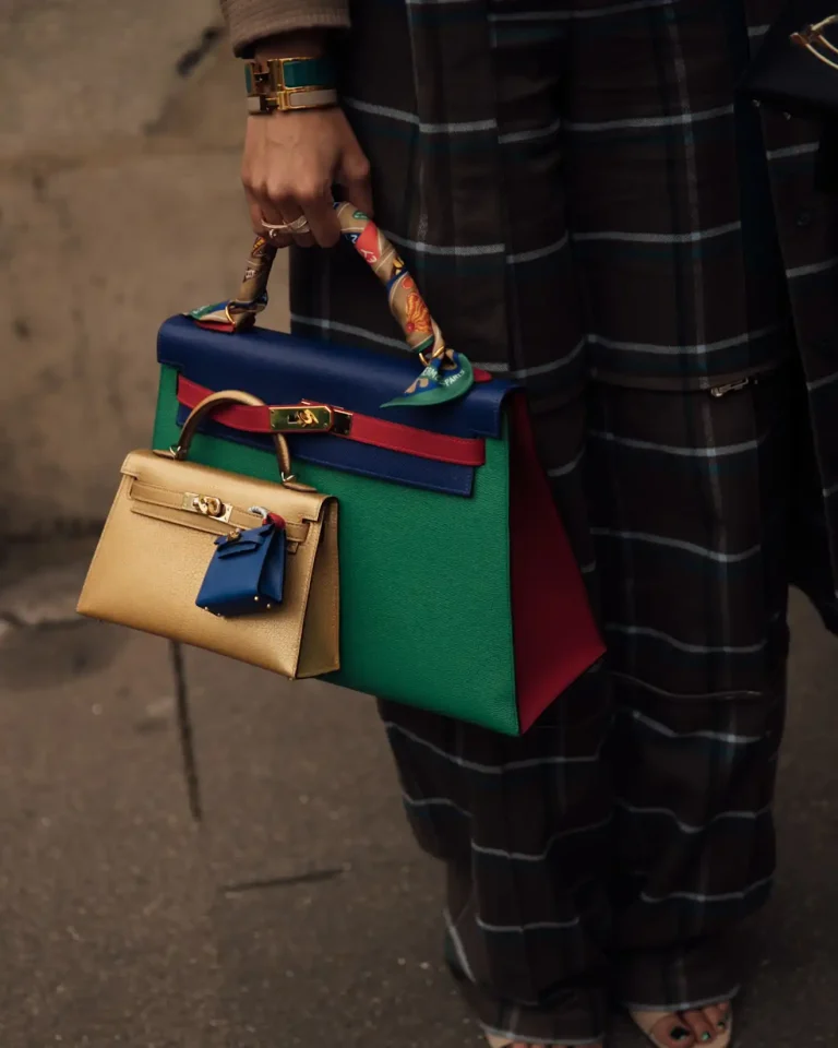 Stacked Hermès Kelly bags by the Babani sisters